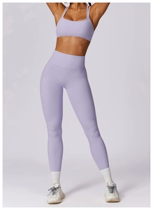 Detailed view of light purple yoga set with cross-back sports bra and high-waist leggings