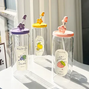 Detail of high borosilicate glass cups with fruit illustrations and colorful lids