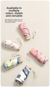 Detailed view of five mini capsule umbrellas with various oil painting floral patterns