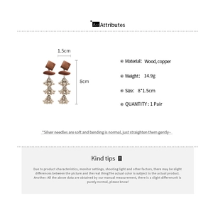 Tableau de tailles détaillé montrant dimensions et matériaux des boucles d'oreilles