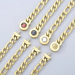 Detail of titanium steel gold bracelets with ruby, black stone, and skull clasp designs