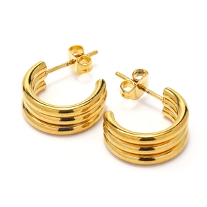 Detail of 18k gold triple-layered C-shaped stud earrings with polished finish