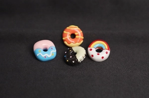 Macro detail of colorful resin donut charms for clothing and DIY accessories