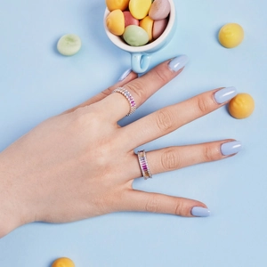 Close-up of S925 sterling silver rings with colorful zircon on a model hand