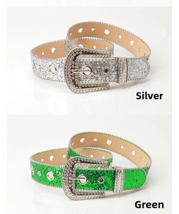 Close-up of silver and green glitter belts with rhinestones and western buckles