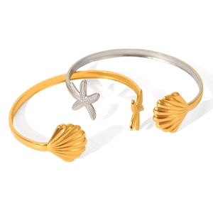 Adjustable ocean style open bracelet in gold and silver with starfish and shell details