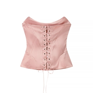 Detailed back view of a pink satin corset top with adjustable lace-up ribbon closure