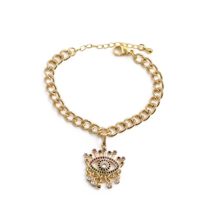 Gold-plated Evil Eye bracelet for kids with colorful zircon stones on white background