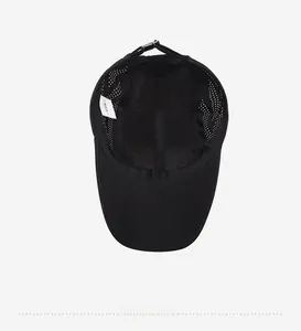 Detail of black quick-dry sports cap showing breathable honeycomb mesh and adjustable strap