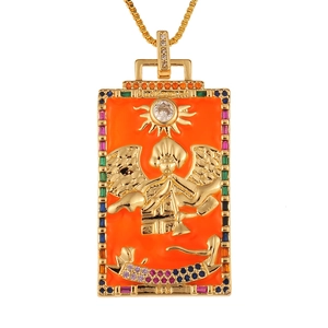 Macro detail of golden Tarot Judgement pendant with enamel inlay and colorful gemstones