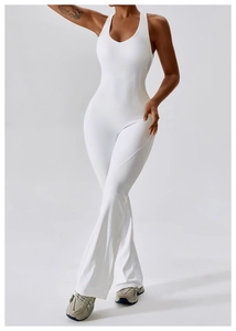 Detail of white sleeveless flared yoga jumpsuit with cross back and high-stretch fabric