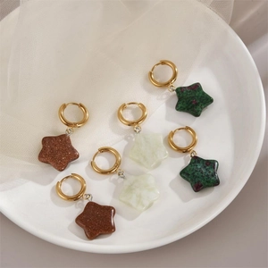 Star-shaped natural stone earrings set in gold hoops featuring three varied earth tones