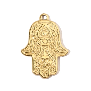 Detailed close-up of a gold-plated Hamsa Hand charm with intricate embossed patterns