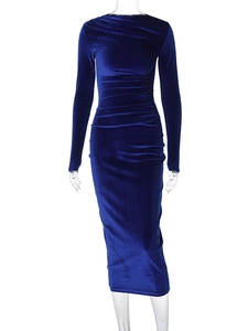 Detail of royal blue velvet dress showing side ruching and soft fabric texture