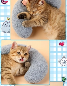 Close-up of a soft blue sherpa crescent moon pet pillow for cat neck support and sleep