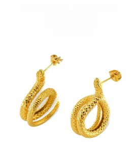 Detailed view of golden snake-shaped earrings with fine scale texture and 18K plating