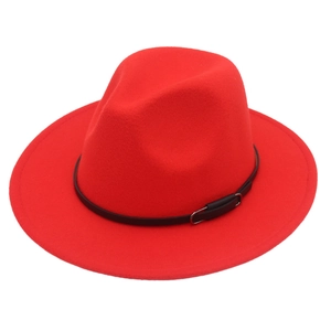 Detail of red wool felt fedora featuring a slim black leather band and silver buckle