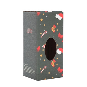 Detail view of the green Christmas LED lamp packaging with festive holiday patterns