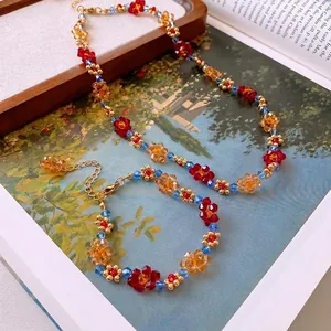 Ensemble collier et bracelet de fleurs fait main avec perles en cristal rouge et bleu