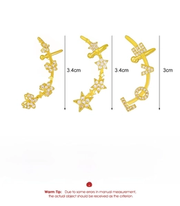 Detailed view of 3.4cm gold-plated butterfly and star zircon ear cuffs made of copper