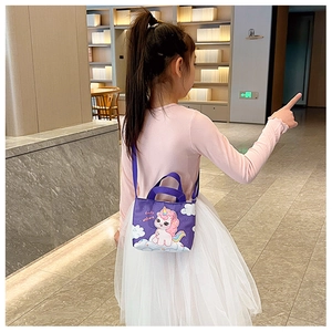 Girl wearing purple Lucky Unicorn crossbody bag with pink top and white mesh skirt