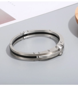 Industrial style stainless steel hinge bracelet featuring matte black carbon fiber inlay