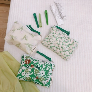 Three-piece floral cotton coin purse set in mint and dark green with zipper closures