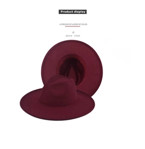 Detailed interior of wine red wide brim felt hat showing stitching and sweatband