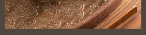 Detailed close-up of the wooden tray with patterned glass base and smooth timber frame
