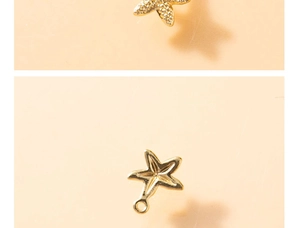 Macro detail of starfish charm pendant showing textured front and smooth metal back surface