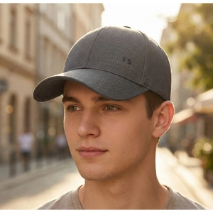 Outdoor lifestyle shot of a dark grey men baseball cap with FS FASHION embroidery