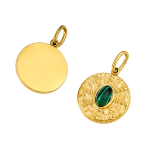 Detail of round gold pendant with green malachite stone and hammered texture finish