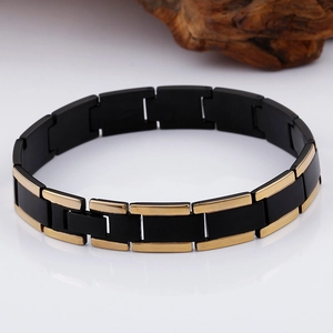 Detail of two-tone gold and black titanium steel link bracelet with polished finish