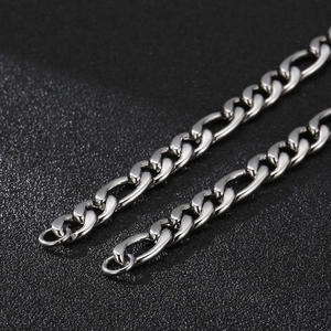 Polished silver Figaro chain necklace made of stainless steel with glossy metal finish