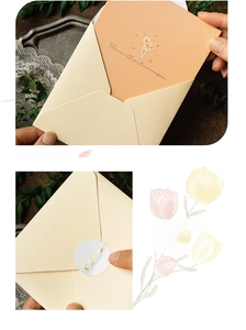 Close-up of a cream stationery set featuring tulip cards and gold For U sealing stickers