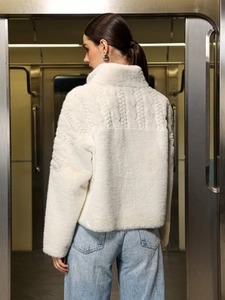 Chic white faux fur jacket for women with cable knit back detail and turtleneck design