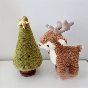 Detailed close-up of soft plush Christmas reindeer and green tree holiday decorations