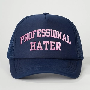 Navy blue trucker cap featuring pink Professional Hater embroidery and mesh back