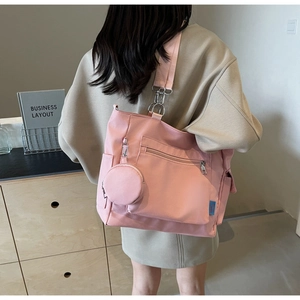 Pink oxford tote bag with side zipper pocket and matching round coin purse accessory