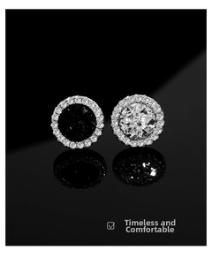 Detailed view of silver crystal cluster stud earrings with black and white centers
