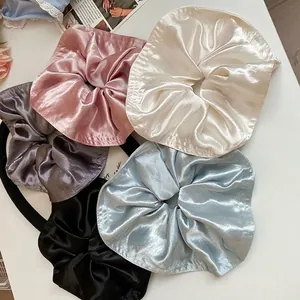 Five-piece set of large satin scrunchies in assorted pastel and neutral elegant colors