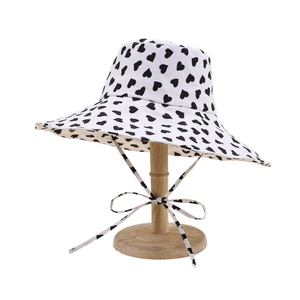 Women's wide brim sun hat with black heart pattern and matching windproof ribbon tie