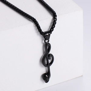 Black treble clef music note pendant with skull design on a black pearl chain