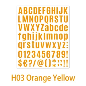 Close-up of DIY orange alphabet and number stickers for journals and gift decorating