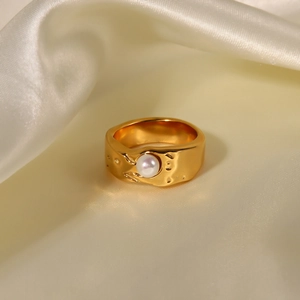 Detailed close-up of 18K gold plated lava texture ring with a central inlaid pearl