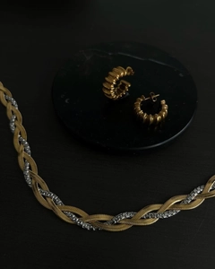 Detail of vintage 18k plated layered snake chain necklace and gold textured hoop earrings