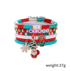Detail of Christmas beaded bracelet set with enamel charms and colorful clay beads