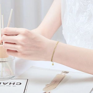 Elegant gold plated stainless steel Figaro chain bracelet for women in a minimalist style