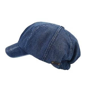 Classic blue denim newsboy cap with leather logo tag and bronze rivet details