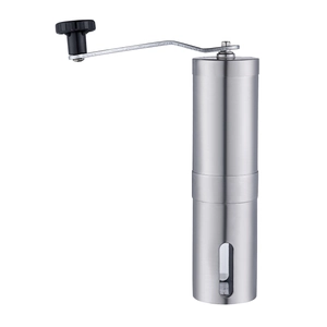 Macro view of stainless steel manual coffee grinder with visible brushed metal texture